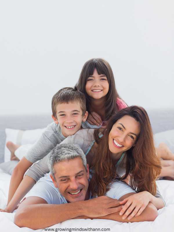 Parents-and-their-children-lying-on-each-other's-back-on-a-beach-sand-in-simple-ways-to-discover-your-child's-love-language-for-better-parenting