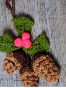 crocheted-acorns-made-with-green-brown-and-pink-yarn-in-10-easy-DIY-christmas-ornaments-for-kids