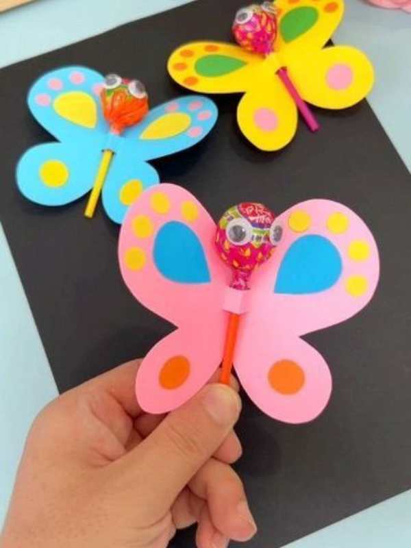 3-lolli-pop-butterfly-made-with-blue-pink-yellow-paper-and-3-lolli-pop-in-fun-and-simple-valentine-craft-for-kids