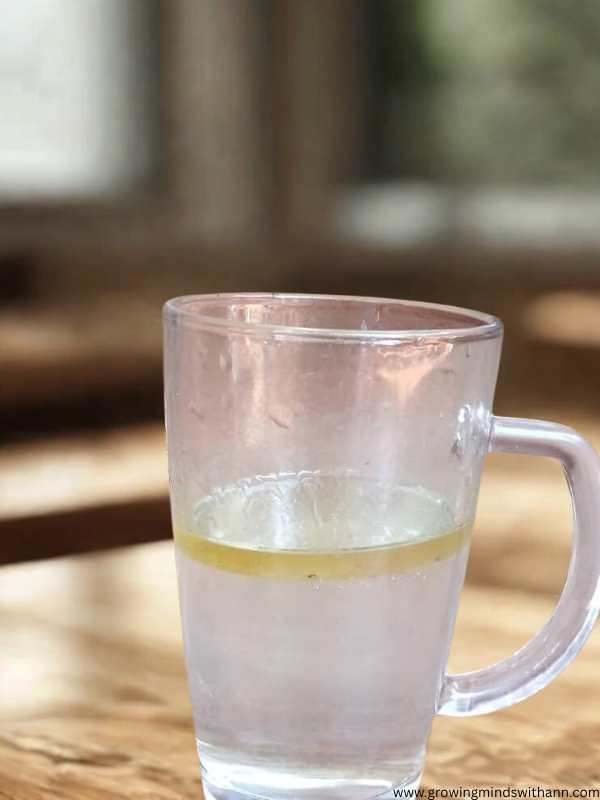 Glass-cup-containing-water-and-oil.