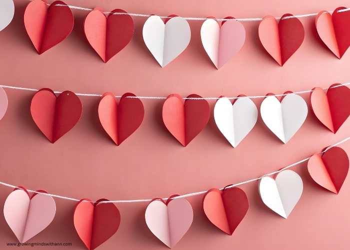 Heart-garland-made-from-white-and-red-paper-in-fun-and-simple-valentine-craft-for-kids.