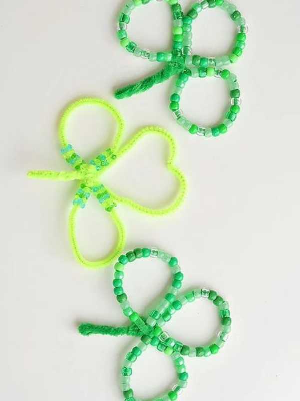 Pipe-cleaner-shamrock-made-with-green-and-white-beads-in-fun-and-easy-st-patrick's-day-crafts-for-kids.