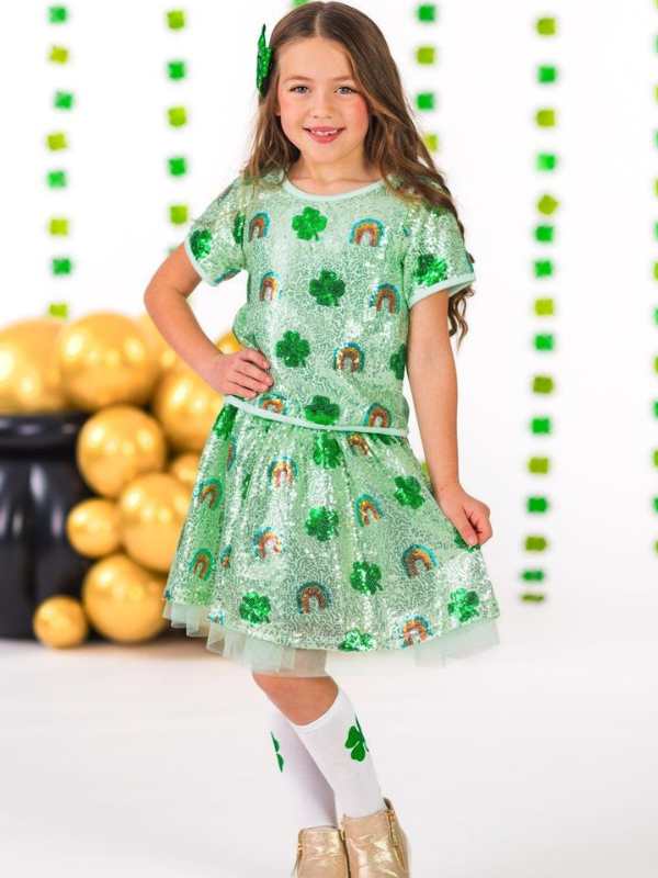 a-girl-putting-on-rainbow-and-shamrock-sequence-top-and-skirt