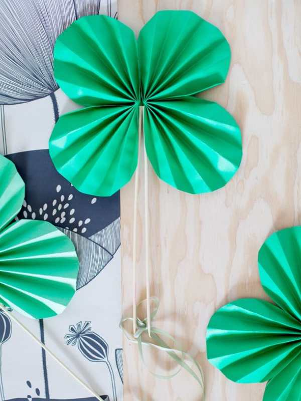 Shamrock-fan-made-from-green-paper-with-thread-to-act-as-a-handle.