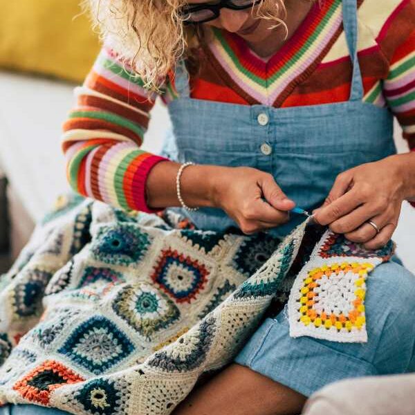 Woman-knitting-a-table-cloth-in-creative-mother's-day-gift-ideas-to-make-and-sell.