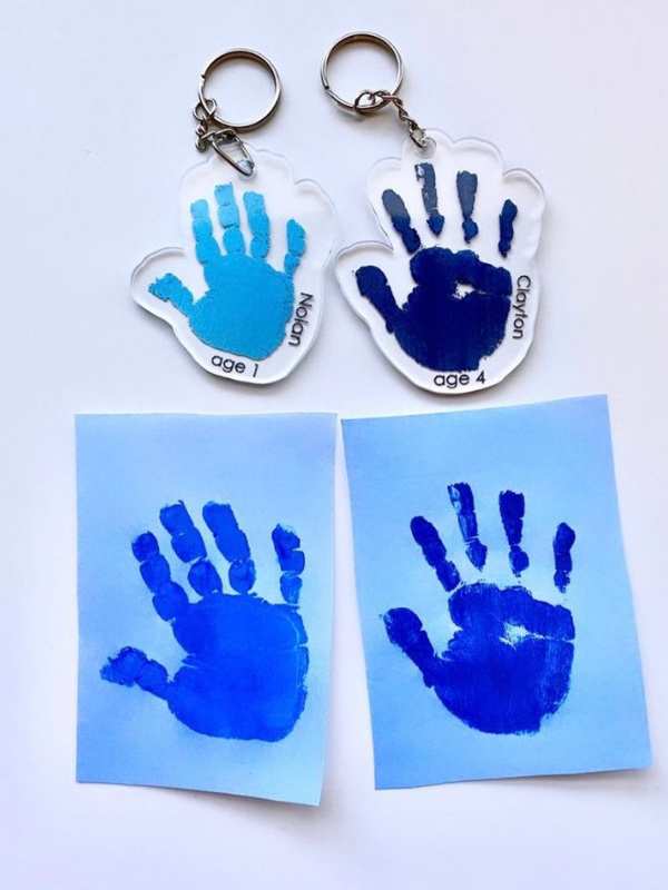 2-handprint-on-paper-and-2-handprint-inside-a-keychain.