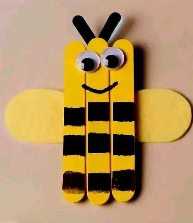 Bumble-bee-made-with-popsicle-stick-colored-with-yellow-and-black-paints-in-fun-and-creative-spring-crafts for preschoolers.