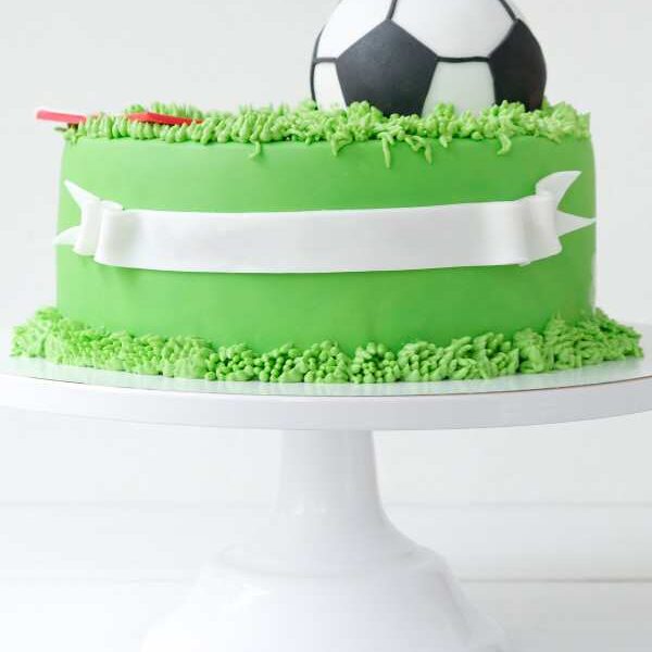 cake-designed-green-and-white-with-football-on-top.