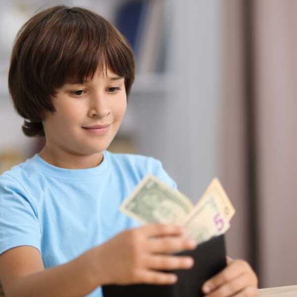 Boy-in-blue-bringing-out-money-from-wallet-in-what-to-do-when-your-child's-steals-money-calm-step-by-step-guide-for-moms.