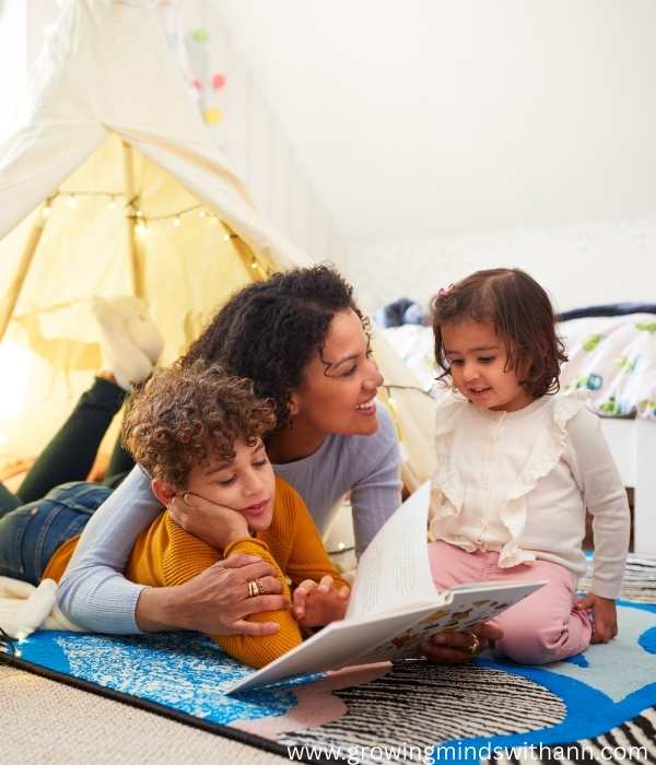 Mom-and-2-kids-on-a-mat-reading.