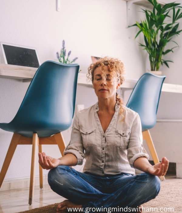 Mom-in-white-and-blue-meditating-in-motherhood-vision-board-ideas-for-intentional-parenting.