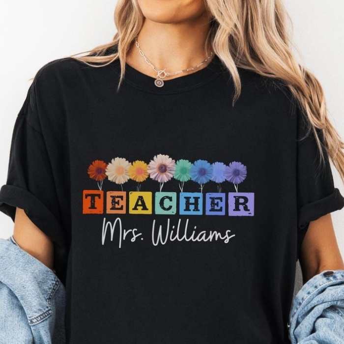 A-black-T-shirt-designed-with-flower-and-written-teacher-mrs-willams-in-surprise-teacher's-day-gift-ideas-they-will-never-forget.