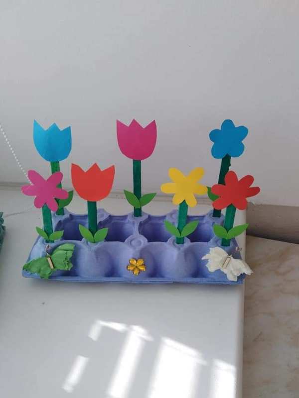 Flowers-in-a-garden-designed-with-egg-caton-and-painted-with-different-colors.