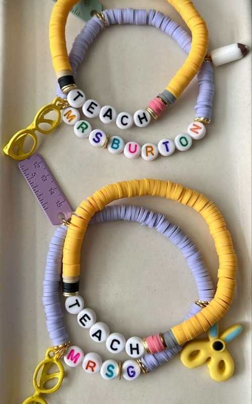 Yellow-and-purple-bracelet-inscribed-teach-and-mrs-G.