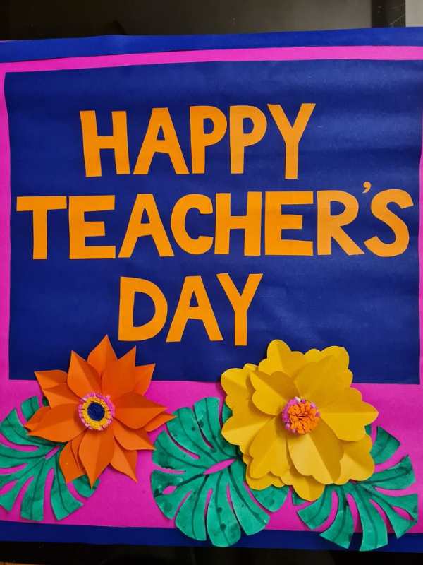 Banner-written-happy-teacher's-day-withorange-colors.