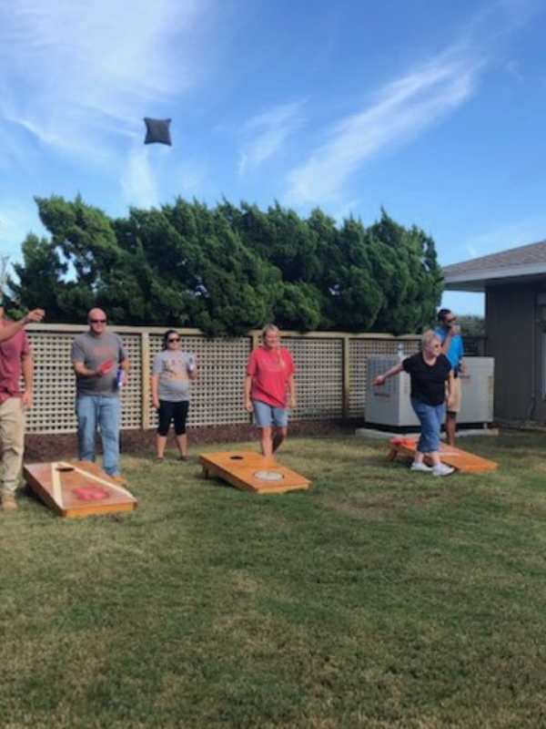 People-tryin-to-participate-in-the-cornhole-tournament-in-fun-4th-of-July-games-your-family-will-love'