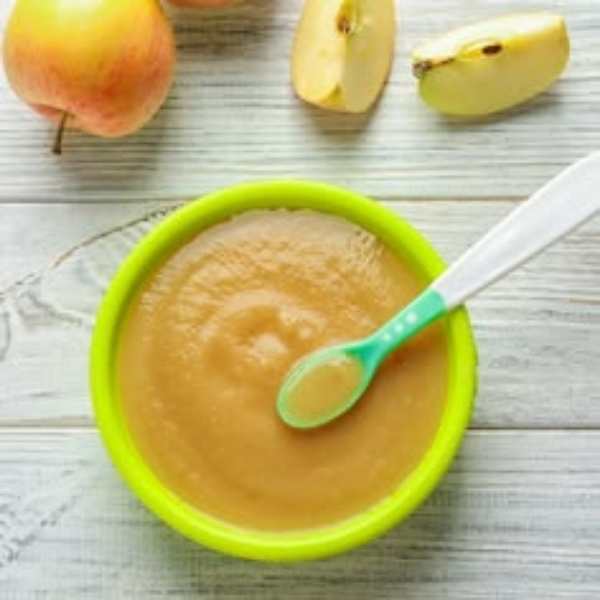 Lemon-color-plate-containing-apple-pear-puree-with-apple-beside-it.