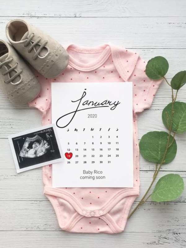 January-calendar-on-top-of-pink-pindown-with-shoe-and-ultrasound-picture-beside-it-in-memorable-first-bab-announcement-ideas-to-tell-your-big-news.
