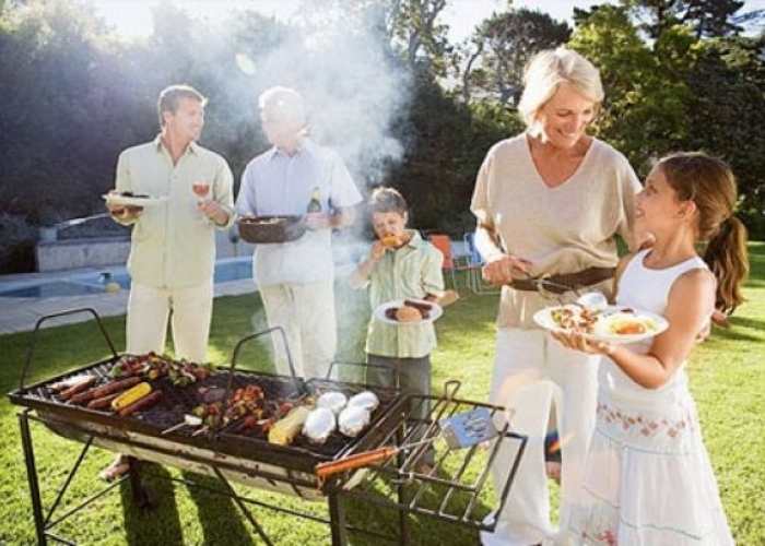 Family-gilling-meats-and-food-in-their-compound.