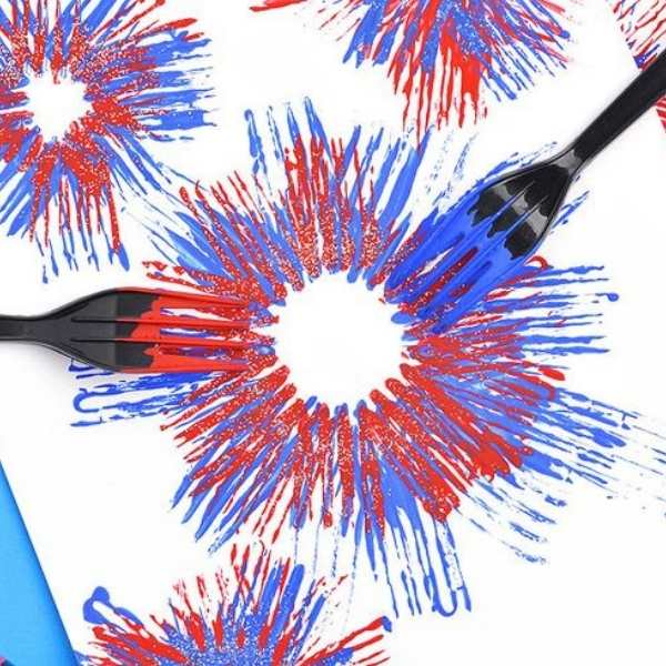Red,-blue-and-white-paint-stamped-on-a-white-paper-with-fork-to-make-fireworks.