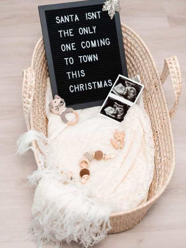 White-baby-blanket-with-toys-ultrasound-picture-and-black-board-written-santa-is-not-the-only-one-coming-in-memorable-first-baby-announcement-ideas-to-share-your-big-news.