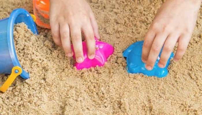 @-hands-using-scoops-to-play-with-sand-in-easy-sensory-activities-for-toddlers-and-preschoolers.