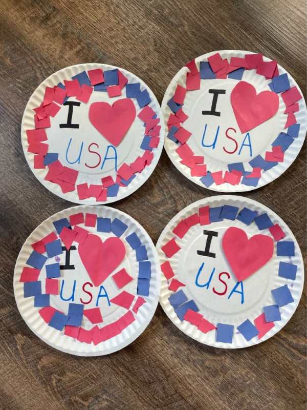 White-paper-plate-designed-with-red-and-blue-paper-written-I-love-USA.