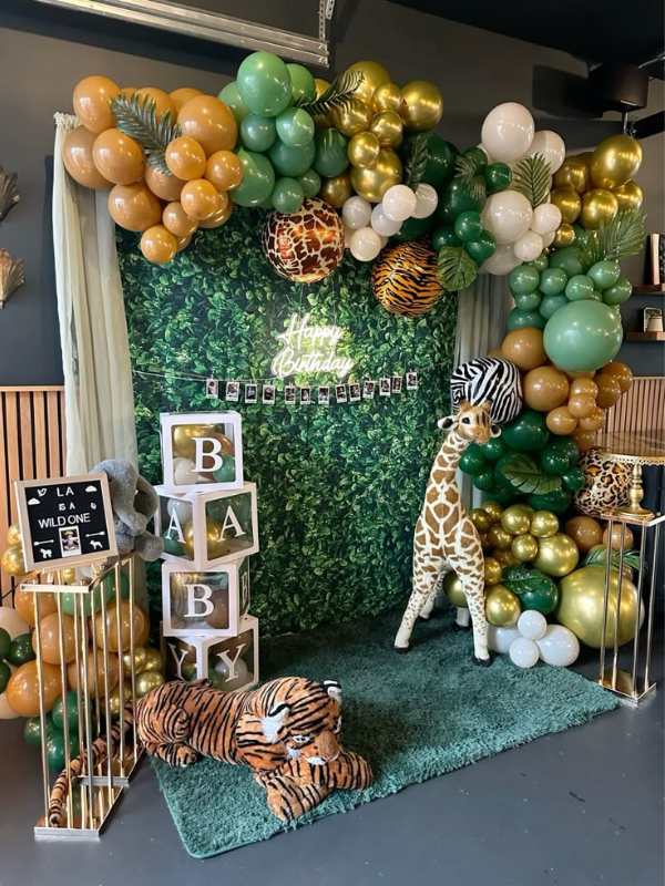 Safari-balloon-arch-tiger-and-safari-toys-in-cute-and-affordable-tropical-baby-shower-theme-ideas.