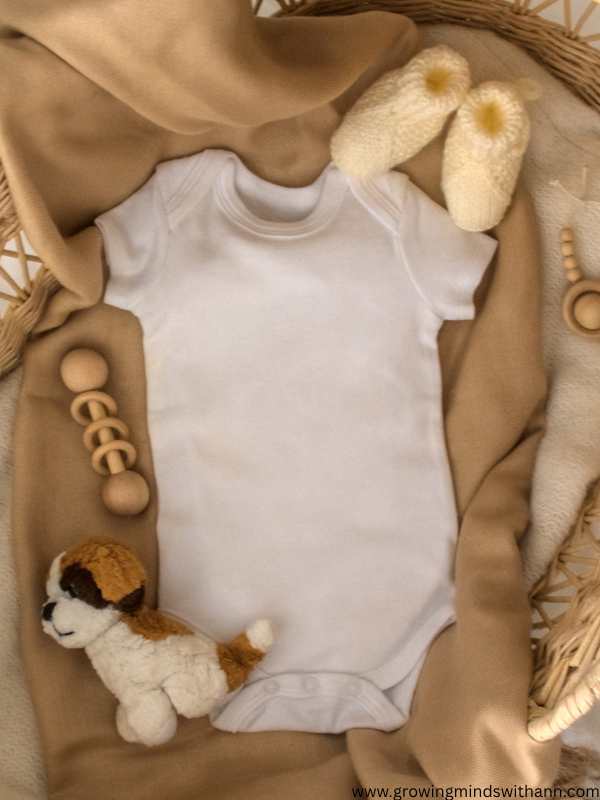 Baby-cloth-shoes-and-toys-lay-flat-on-a-surface-in-super-creative-pregnancy-announcement-ideas.