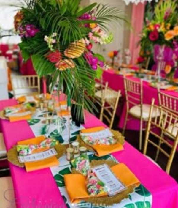 centerpiece-table-with-different-colors-of-design-and-palm-in-cute-and-affordable-tropical-baby-shower-theme-ideas.