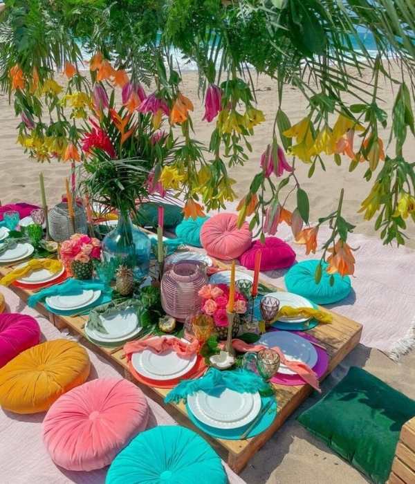Centerpiece-with-plates-of-different-colors-with-palm-on-top-in-cute-andaffordable-tropical-baby-shower-theme-ideas.