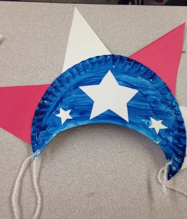 Paper-plate-hat-designed-with-red-white-and-blue-paint-in-fun-and-creative-4th-of-July-crafts-for-kids.