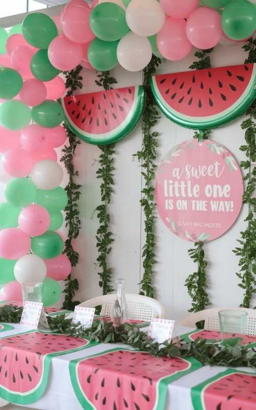 Green-red-and-white-balloon-hanged-on-the-wall-with-watermelon-balloon-in-cute-and-affordable-tropical-baby-shower-theme-ideas.
