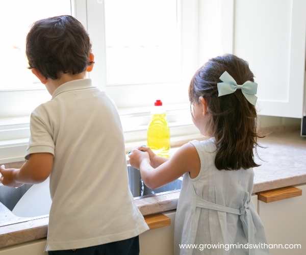 2-kids-washing-plate-in-fun-sibling-bonding-activities-to-reduce-sibling-rivalry-at-home.