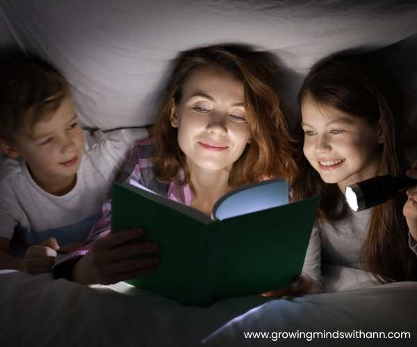 Mom-reading-stories-for-her-2-kids-in-fun-sibling-bonding-activities-to-reduce-sibling-rivalry-at-home.