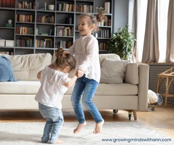 2-kids-dancing-in-the-living-room.