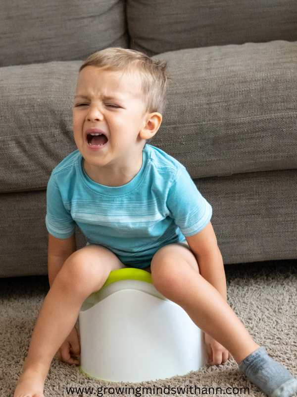 Toddler-crying-while-sitting-on-a-potty.