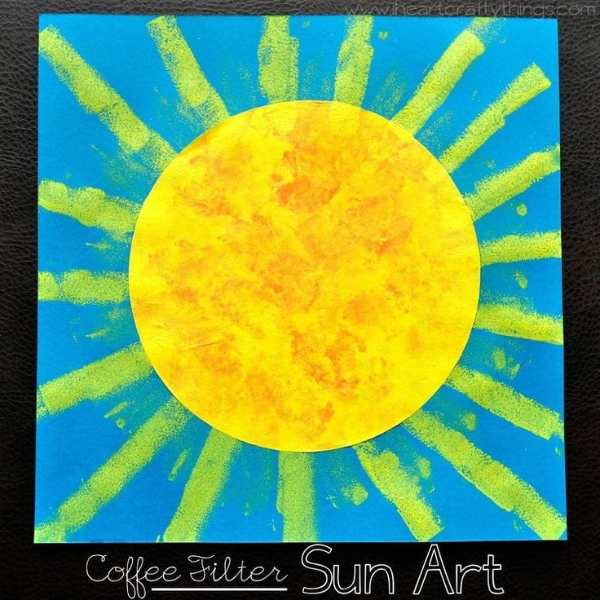 Coffee-filter-sun-craft-designed-with-yellow-and-red-on-a-blue-background.