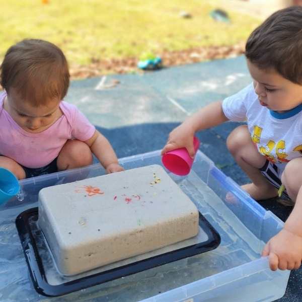 2-toddlers-playing-with-frozeen-sand-in-easy-summer-sensory-activities-for-toddlres-and-preschoolers.