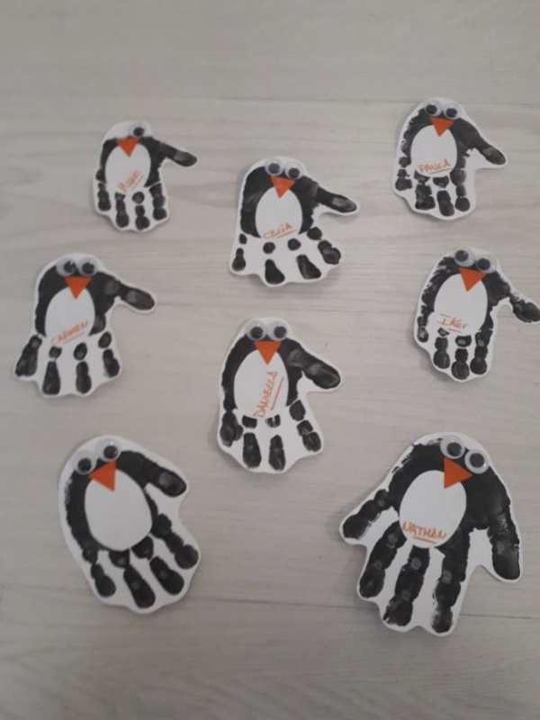 8-handprint-penguin-on-a-white-paper.