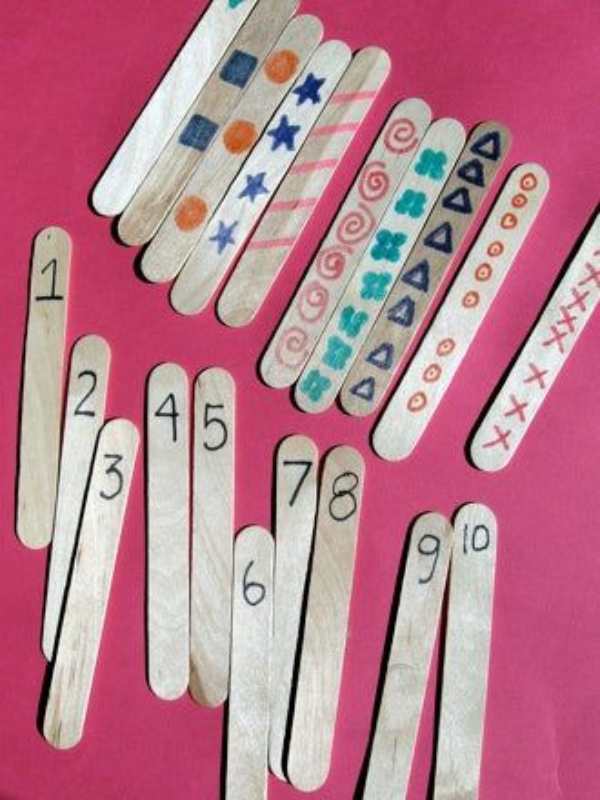 2-sets-of-popsicle-sticks-each-with-a-figure-and-a-corresponding-number-of-items.