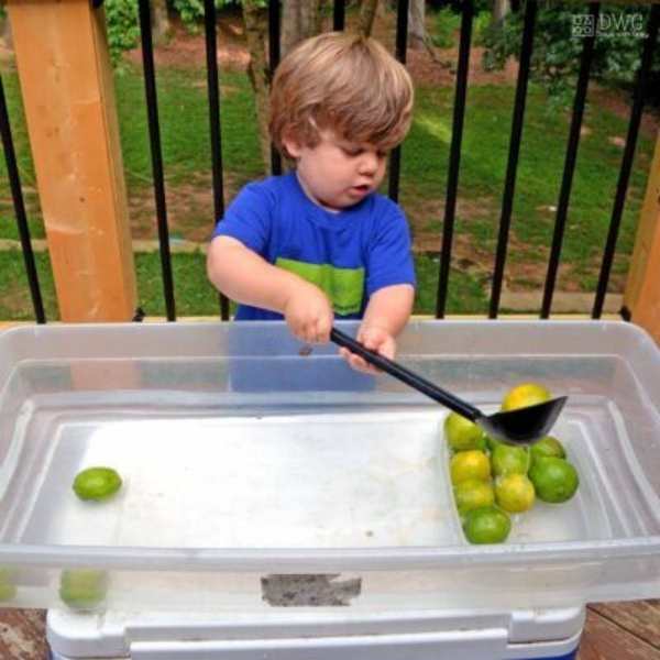 Child-scooping-lime-from-water.