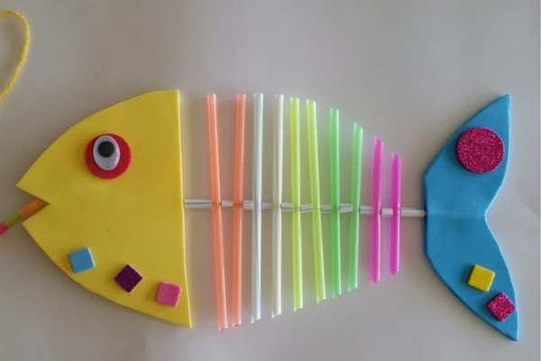 Fish-made-with--pink-yellow-green-and-orange-straws-in-fish-bones-straaw-threading-activity.
