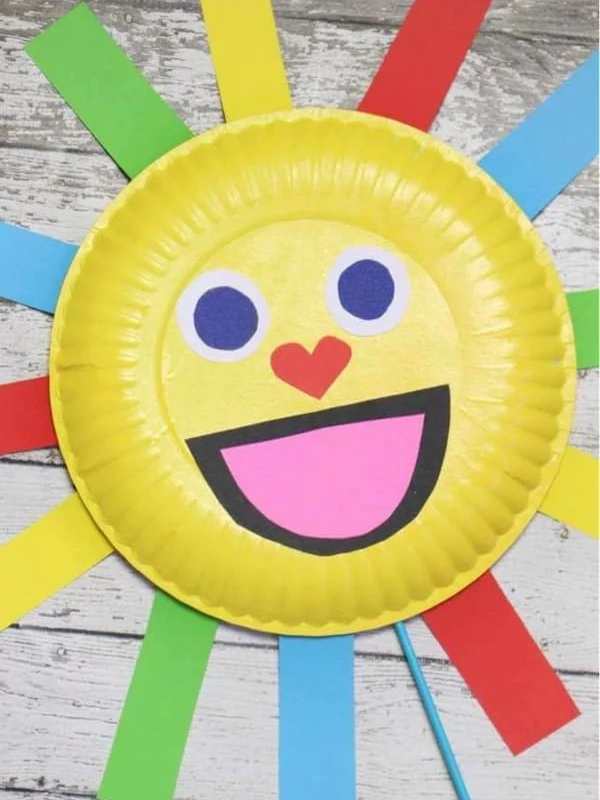 Sun-puppet-made-with-yellow-green-red-and-blue-paper-in-cute-sun-crafts-for-preschoolers.