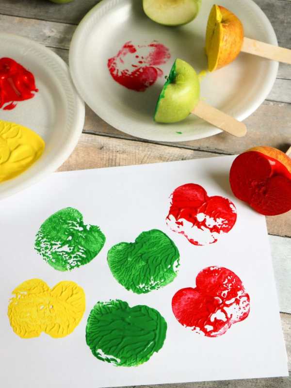 Red-green-and-yellow-apple-stamp-on-a-white-paper.