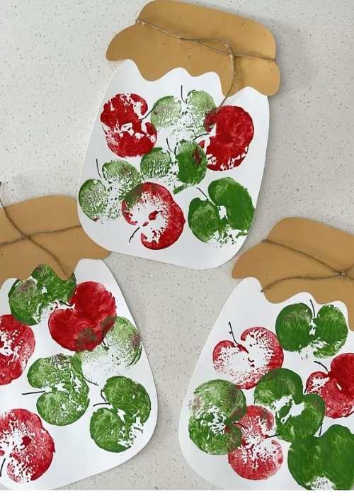 Red-and-Green-apple-stamp-on-white-paper-in-harvest-craft-ideas-for-kids-that-are-easy-and-fun.