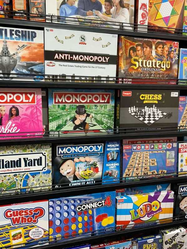 Shelve-containing-different-board-game-in-non-toy-gift-ideas-for-elementary-kids.