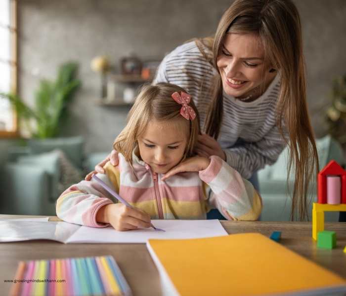 Child-writing-while-the-mom-is-watching.