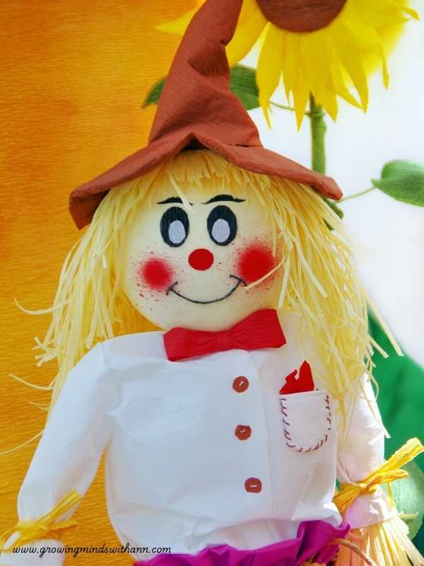 Scarecrow-dressed-in-white-red--and-brown-color-in-harvest-craft-ideas-for-kids.
