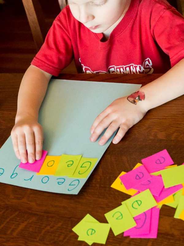 Boy-rearranging-letters-of-his-name.